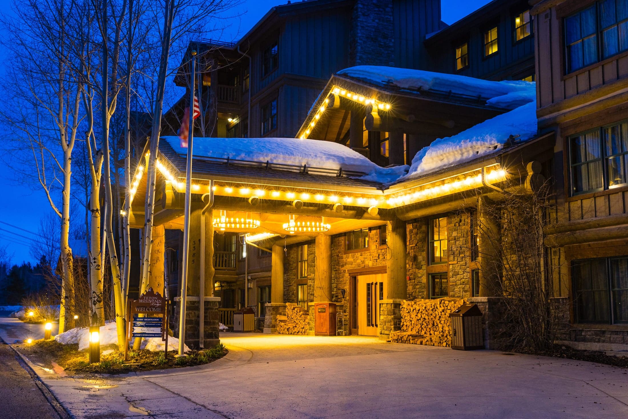 A photo of the Teton Mountain Lodge entrance at night
