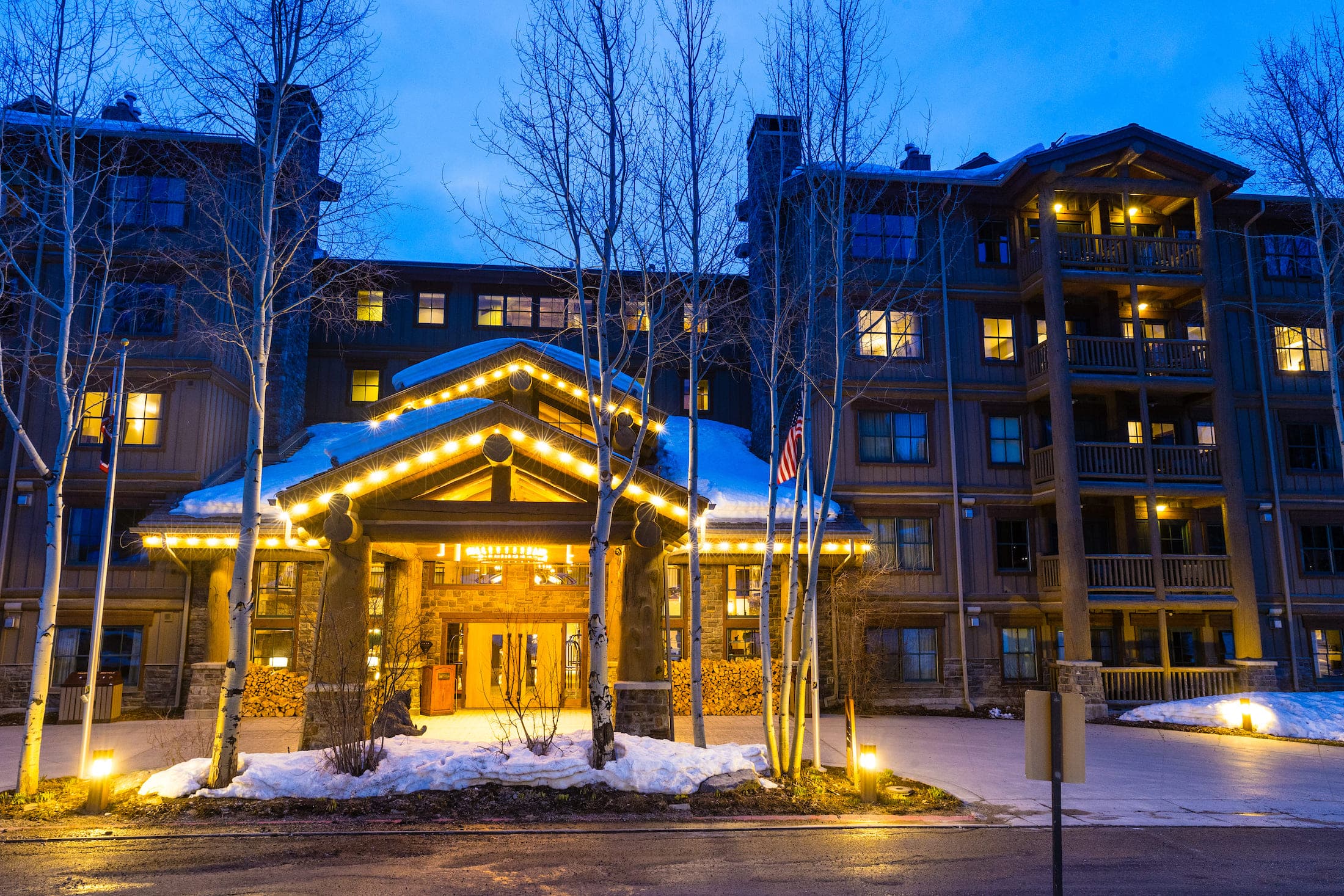 The entrance to Teton Mountain Lodge at night in the winter
