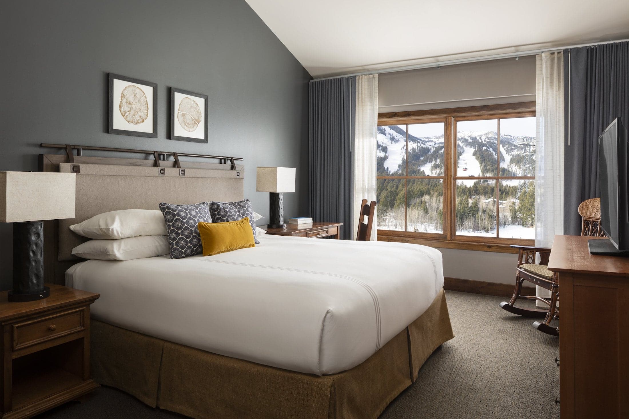 The master bedroom of a Bi-level suite with a Queen-sized bed at the Teton Mountain Lodge
