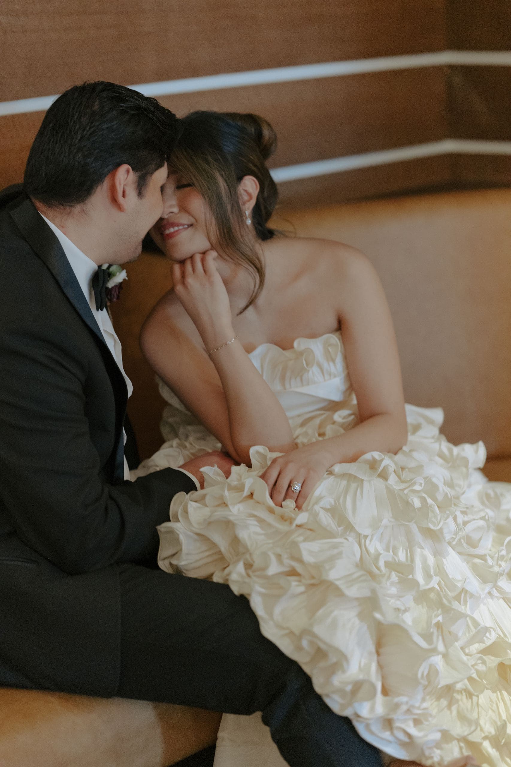 A photo of a wedded couple enjoy a quiet moment together