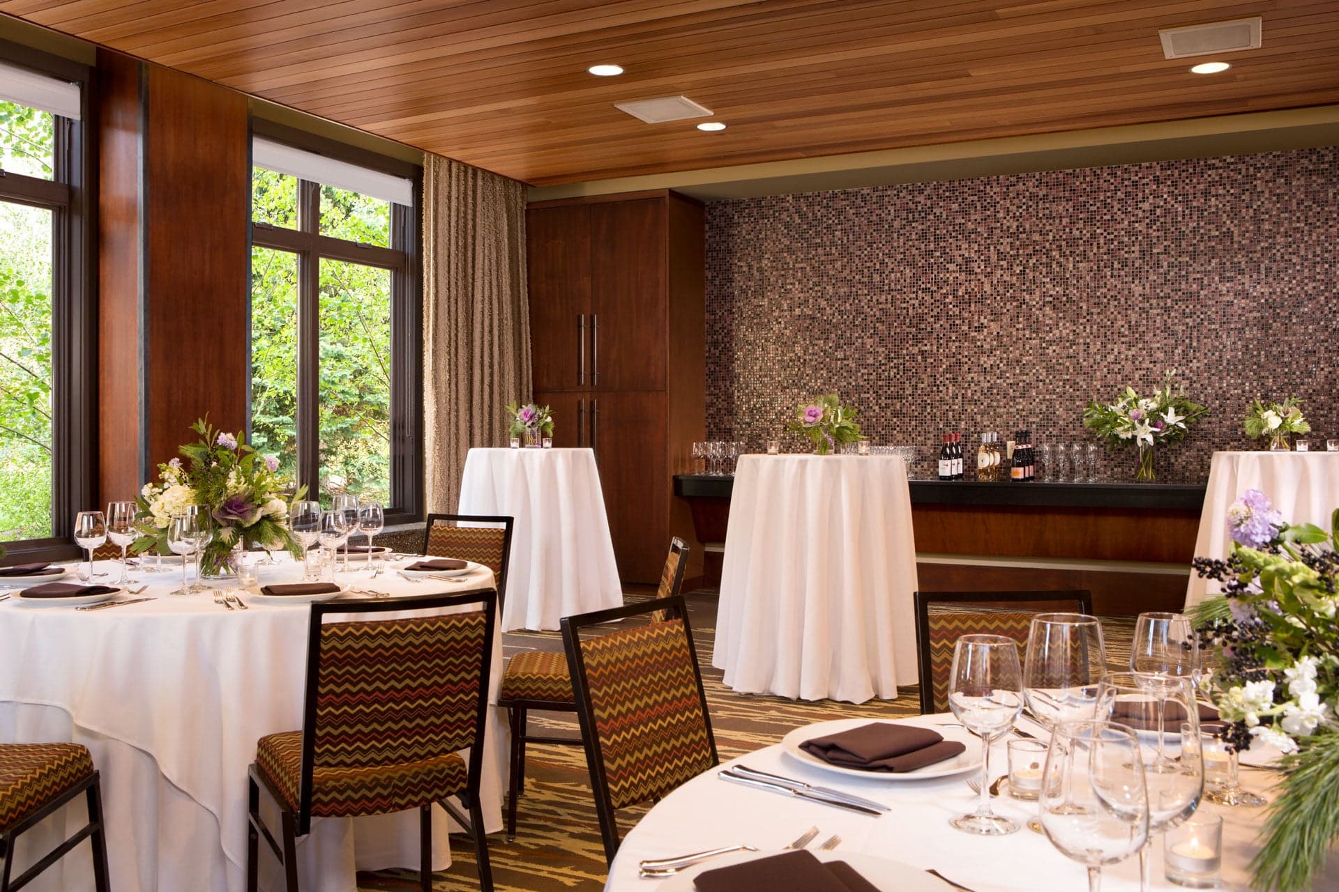 Albright Room, multiple tables and a self-serve bar for reception