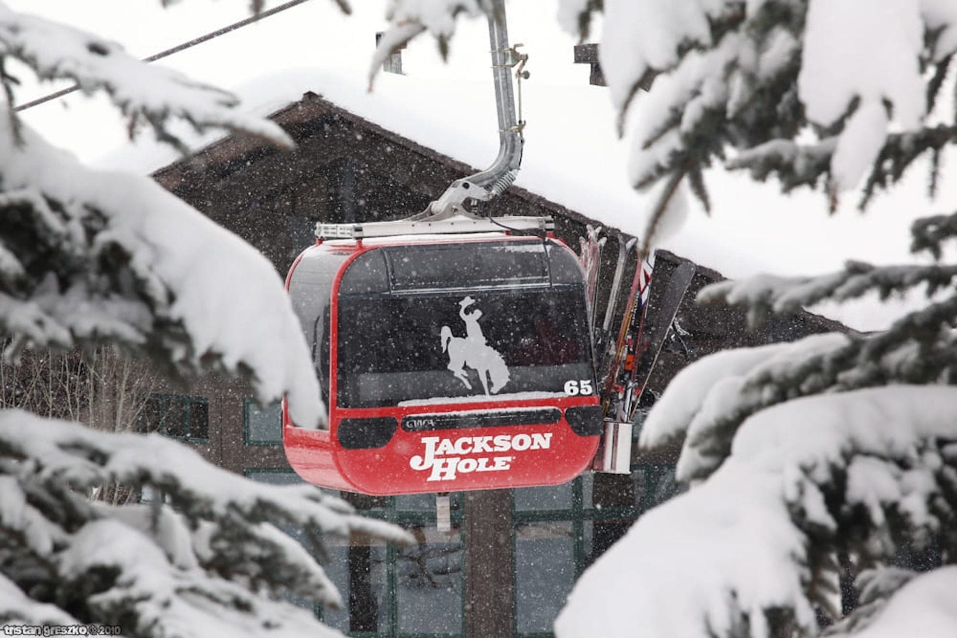 A photo of an aerial tram amidst light snowfall