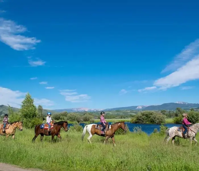 Group horseback riding at Teton Mountain Lodge