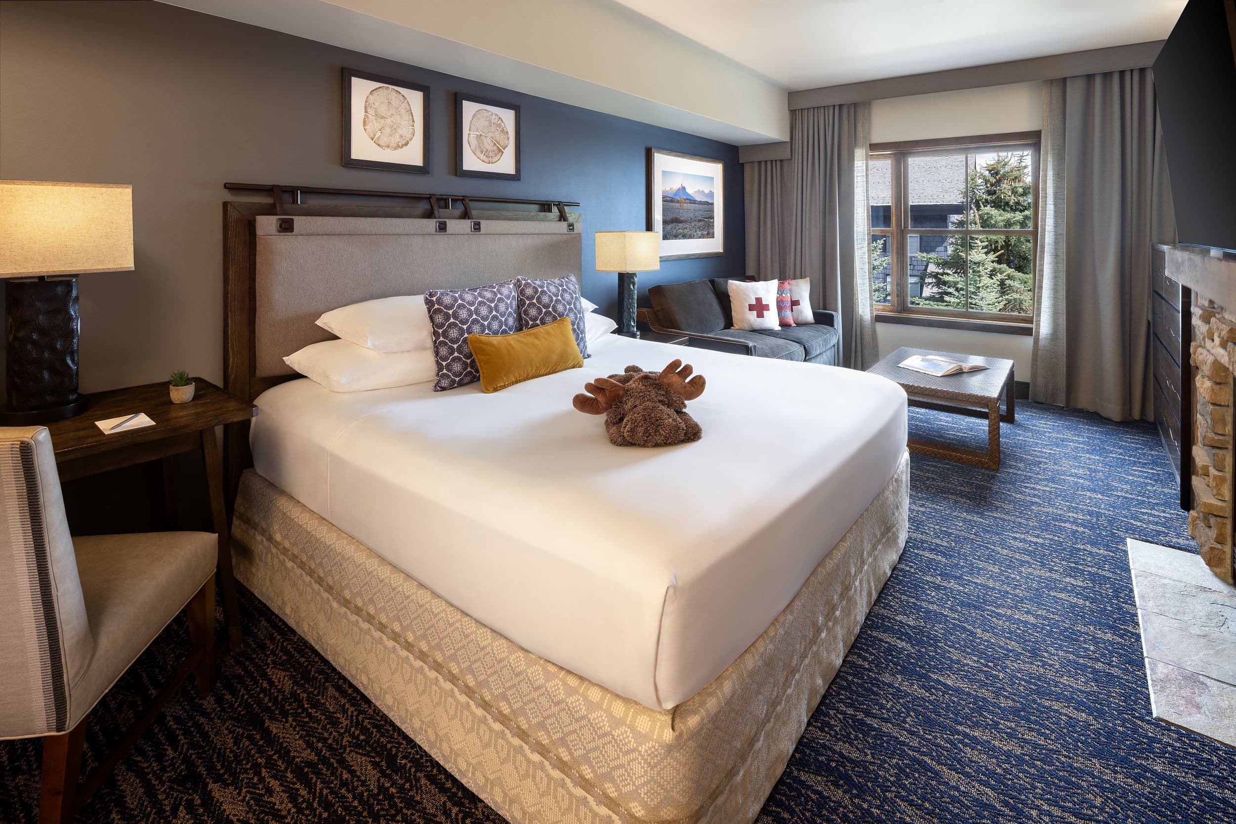 Grand King room with fireplace and sofa at Teton Mountain Lodge, Jackson Hole